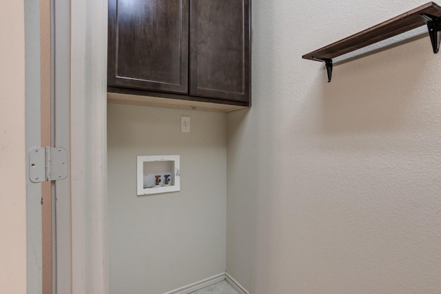 laundry area with cabinets and hookup for a washing machine