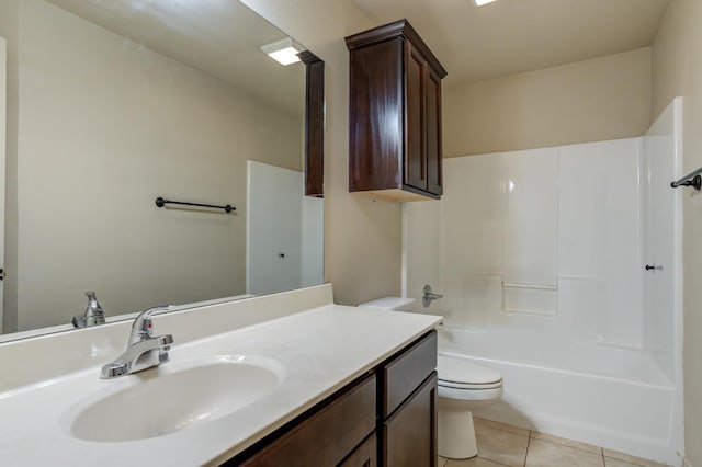 full bathroom featuring toilet, vanity, tile patterned floors, and  shower combination