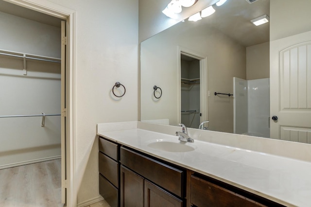 bathroom with wood-type flooring and vanity