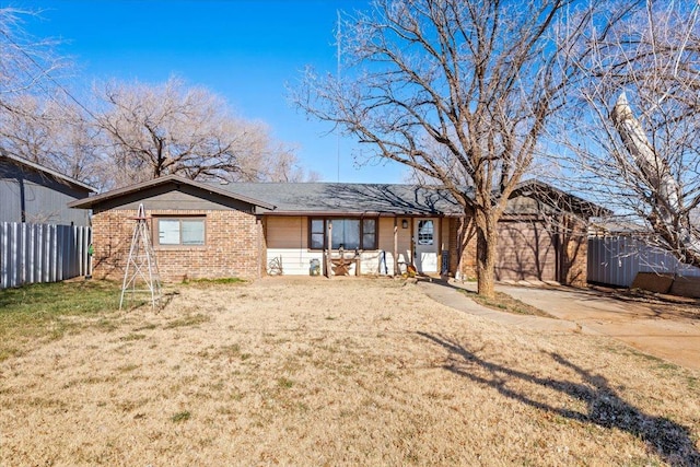 ranch-style home with a front lawn