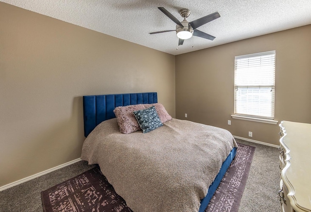 6901 9th St, Lubbock, TX 79416 - carpeted bedroom featuring baseboards, a textured ceiling, and ceiling fan