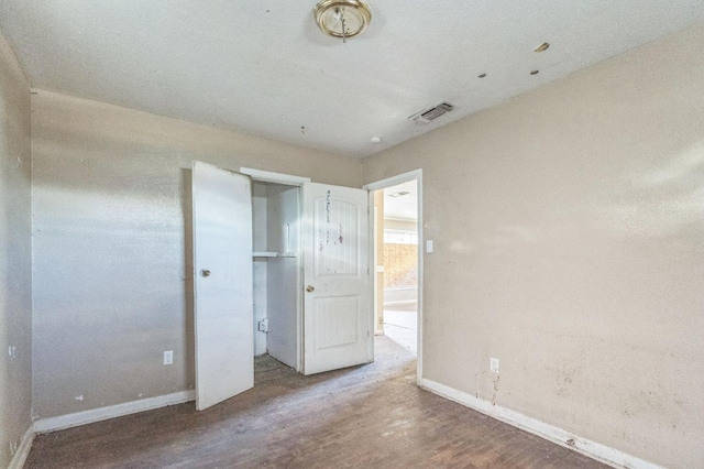 unfurnished bedroom featuring wood-type flooring