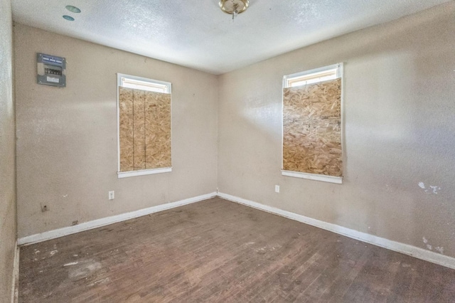 unfurnished room featuring dark hardwood / wood-style floors