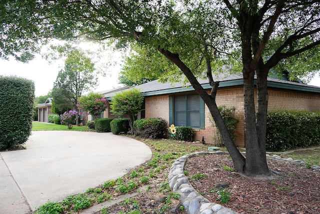 5712 70th Pl, Lubbock, TX 79424 - view of side of property with brick siding