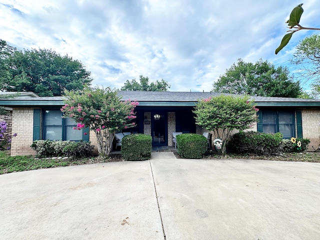 5712 70th Pl, Lubbock, TX 79424 - view of front of house with brick siding and covered porch