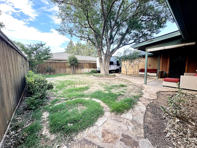 5712 70th Pl, Lubbock, TX 79424 - fenced backyard featuring a patio area