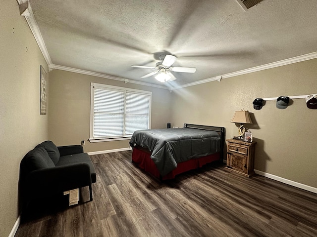 5712 70th Pl, Lubbock, TX 79424 - bedroom with dark wood-style flooring, ornamental molding, a textured ceiling, and ceiling fan