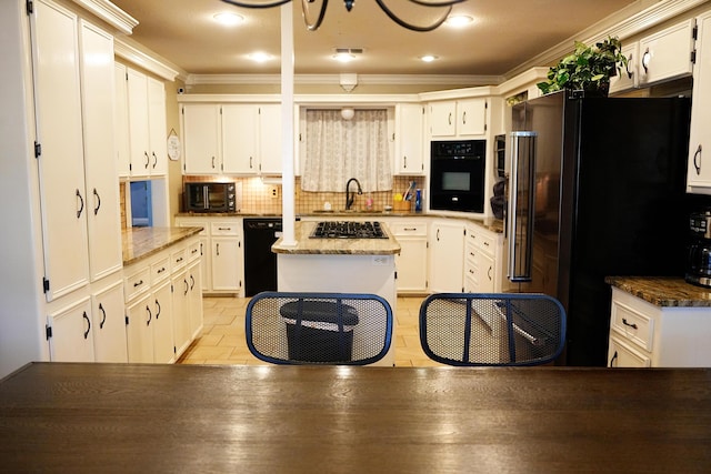 5712 70th Pl, Lubbock, TX 79424 - kitchen featuring black appliances, ornamental molding, backsplash, white cabinetry, and a kitchen island