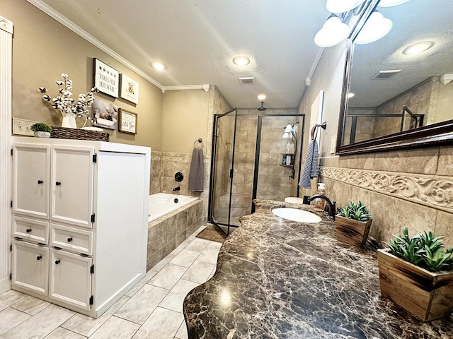 5712 70th Pl, Lubbock, TX 79424 - bathroom featuring crown molding, a textured ceiling, a shower stall, a bath, and vanity