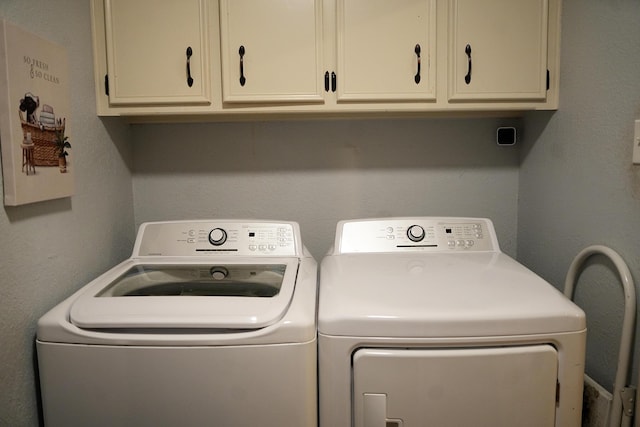 5712 70th Pl, Lubbock, TX 79424 - washroom featuring washer and dryer and cabinet space