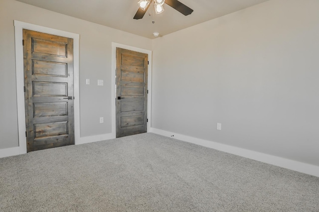 unfurnished bedroom with carpet floors and ceiling fan