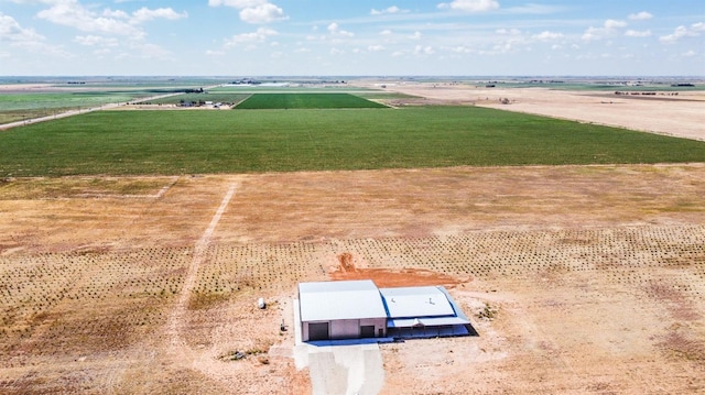 birds eye view of property with a rural view