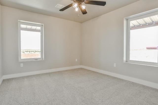 unfurnished room featuring ceiling fan and carpet floors