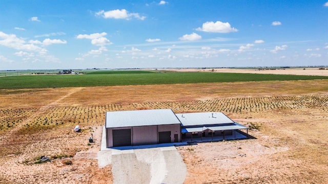 view of storm shelter with a rural view