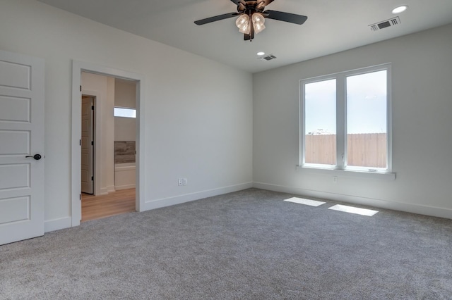 empty room with light carpet and ceiling fan