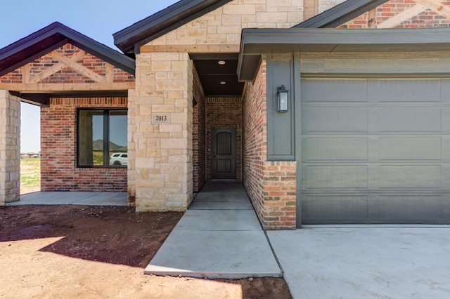 doorway to property featuring a garage