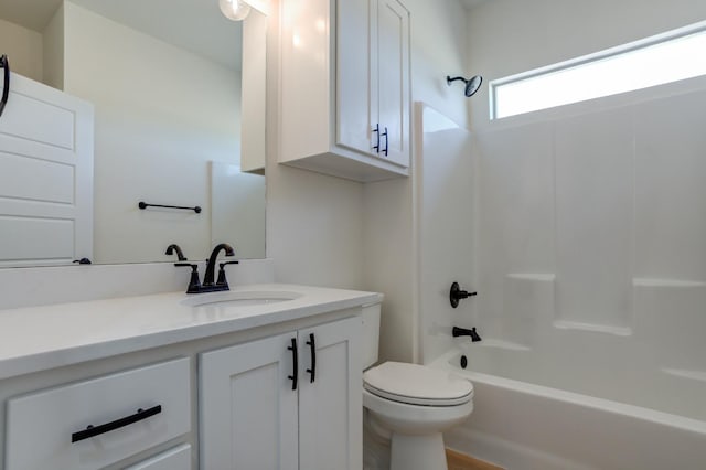 full bathroom with toilet, vanity, and bathtub / shower combination