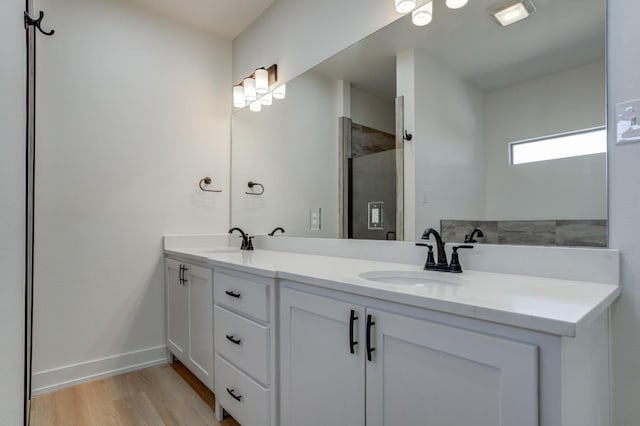 bathroom featuring vanity and hardwood / wood-style floors