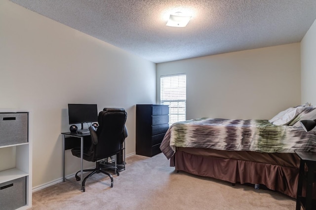 carpeted bedroom with a textured ceiling