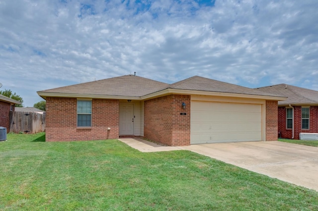 ranch-style house with a garage, central AC unit, and a front lawn