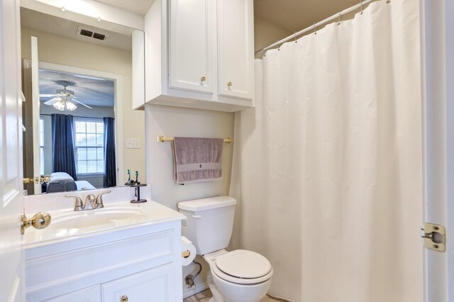 bathroom featuring ceiling fan, vanity, and toilet