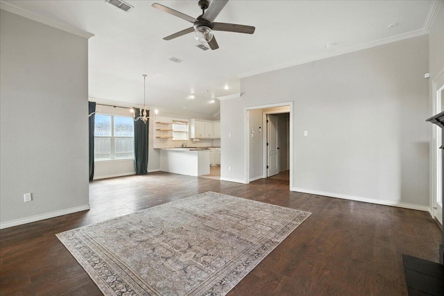 5828 104th St, Lubbock, TX 79424 - living area featuring ceiling fan, crown molding, a chandelier, and dark wood finished floors