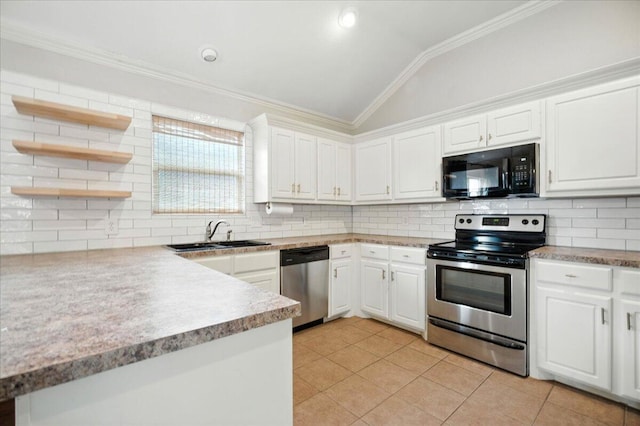 5828 104th St, Lubbock, TX 79424 - kitchen featuring appliances with stainless steel finishes, vaulted ceiling, ornamental molding, white cabinetry, and light tile patterned floors