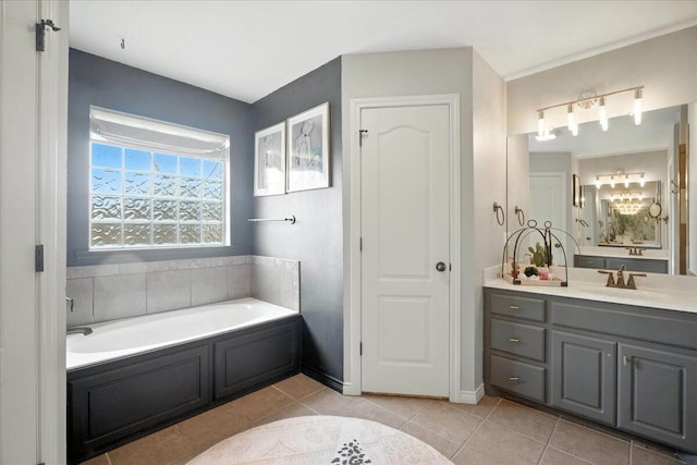 5828 104th St, Lubbock, TX 79424 - full bathroom with a garden tub, vanity, and tile patterned flooring