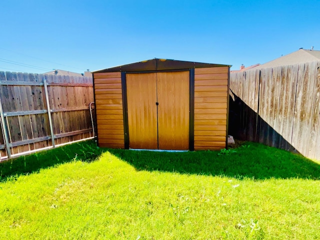 view of outdoor structure featuring a lawn