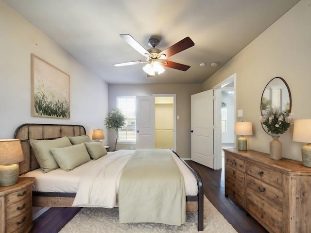 bedroom featuring dark wood-type flooring and ceiling fan