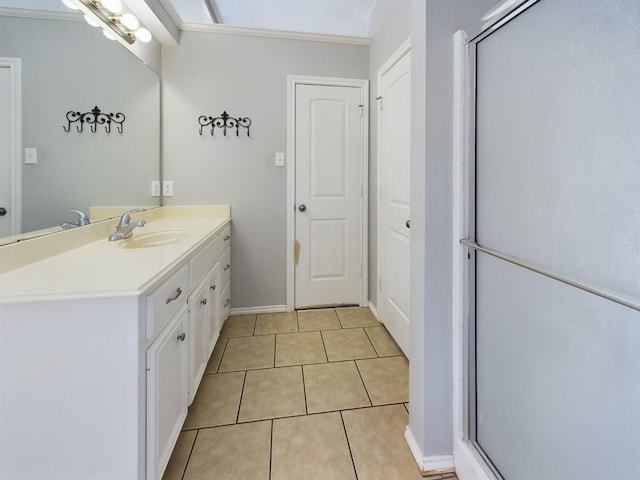 bathroom featuring tile patterned flooring, vanity, and an enclosed shower