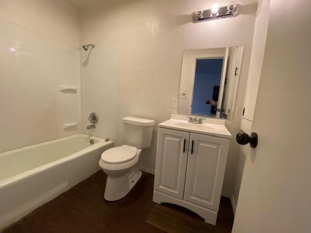 full bathroom featuring shower / tub combination, vanity, toilet, and hardwood / wood-style floors