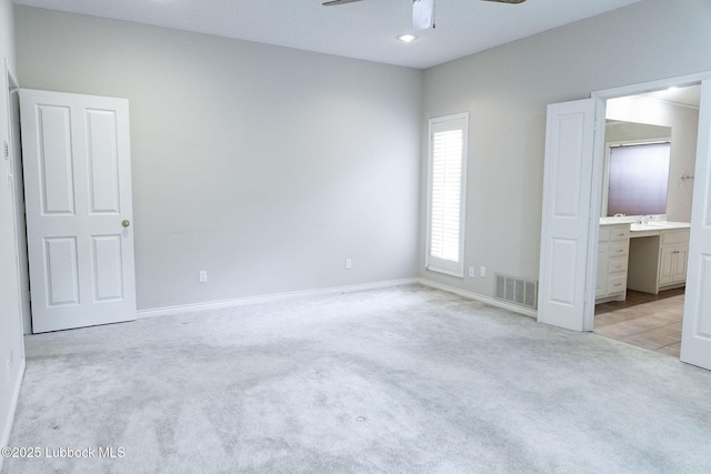 4420 87th St, Lubbock, TX 79424 - unfurnished bedroom with light colored carpet, baseboards, ensuite bath, recessed lighting, and ceiling fan