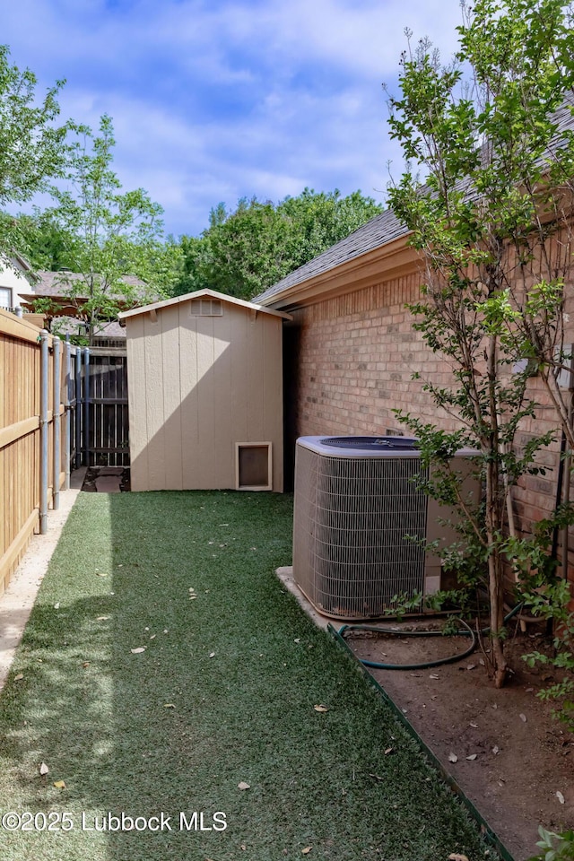 4420 87th St, Lubbock, TX 79424 - view of yard with cooling unit, a storage unit, and an outdoor structure