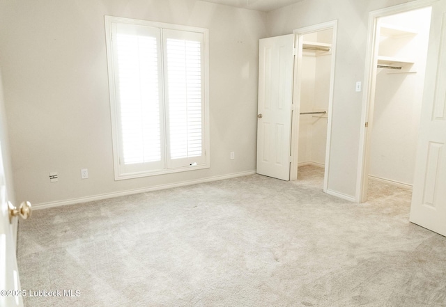 4420 87th St, Lubbock, TX 79424 - unfurnished bedroom with a spacious closet, carpet floors, and baseboards