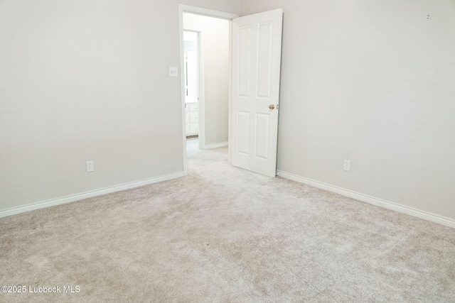 4420 87th St, Lubbock, TX 79424 - carpeted empty room with baseboards