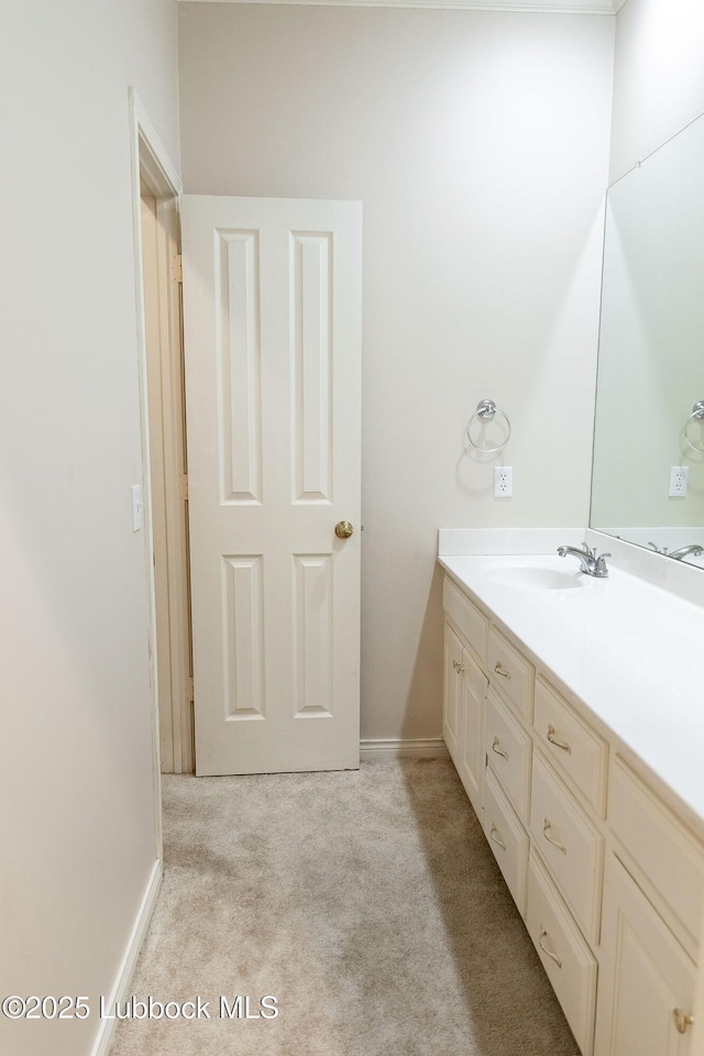 4420 87th St, Lubbock, TX 79424 - bathroom featuring vanity, baseboards, and carpet