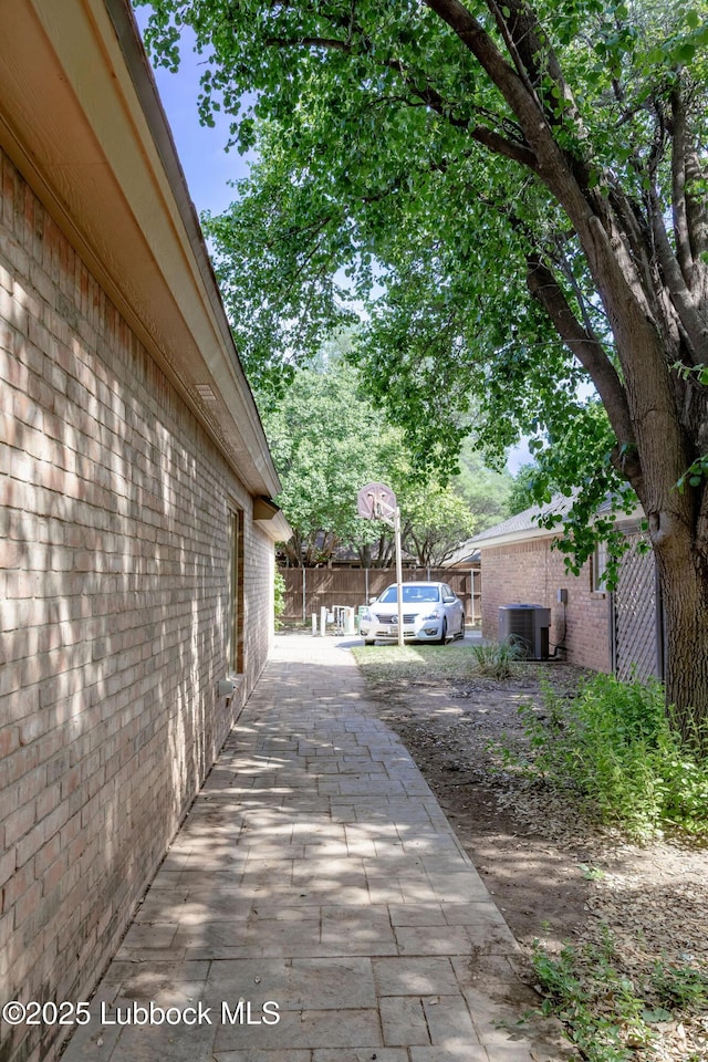 4420 87th St, Lubbock, TX 79424 - view of patio featuring cooling unit and fence