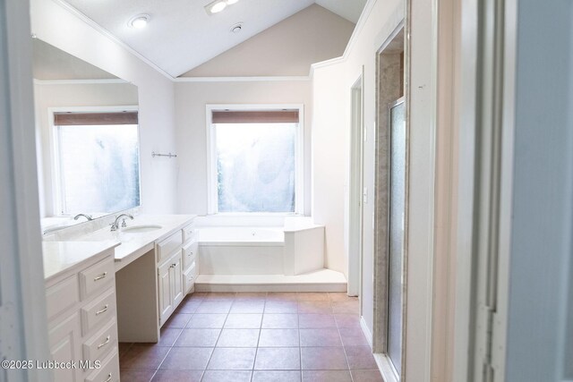 4420 87th St, Lubbock, TX 79424 - full bath with lofted ceiling, crown molding, vanity, a bath, and tile patterned flooring