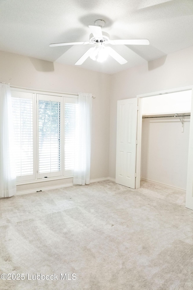 4420 87th St, Lubbock, TX 79424 - unfurnished bedroom with carpet flooring, a closet, a ceiling fan, and baseboards