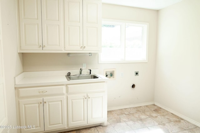 4420 87th St, Lubbock, TX 79424 - washroom with electric dryer hookup, washer hookup, cabinet space, and baseboards