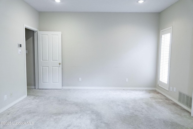 4420 87th St, Lubbock, TX 79424 - carpeted spare room featuring baseboards and recessed lighting