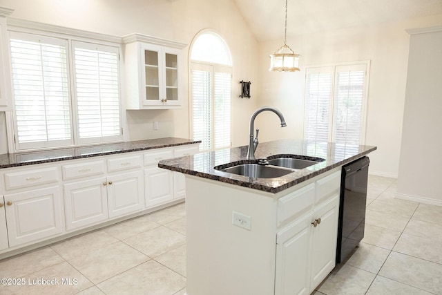 4420 87th St, Lubbock, TX 79424 - kitchen with a sink, dishwasher, light tile patterned floors, vaulted ceiling, and an island with sink