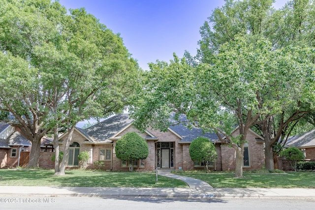 4420 87th St, Lubbock, TX 79424 - single story home featuring brick siding and roof with shingles