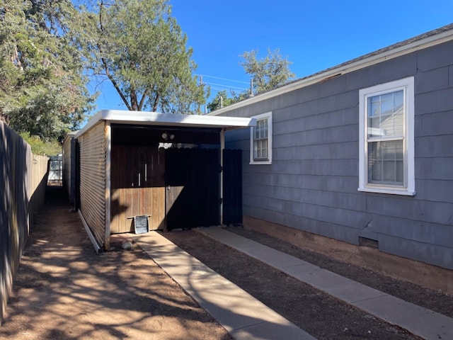 exterior space with a carport