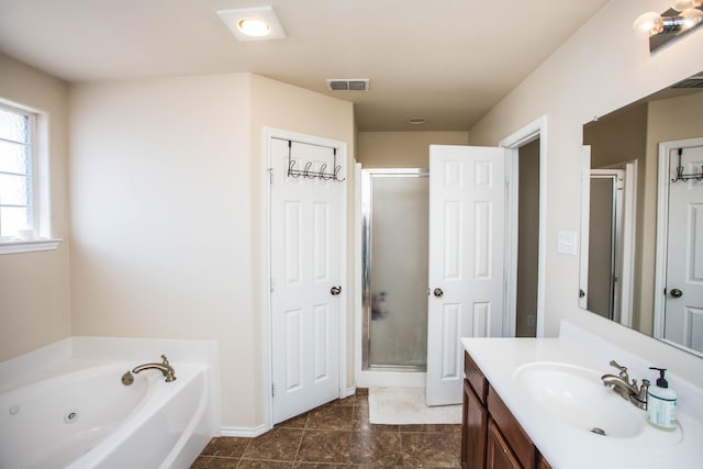 3602 Pontiac Ave, Lubbock, TX 79407 - bathroom with vanity, visible vents, a shower stall, and a tub with jets