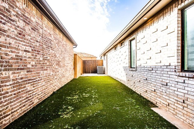 view of home's exterior featuring central AC unit