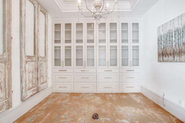 spacious closet featuring a notable chandelier