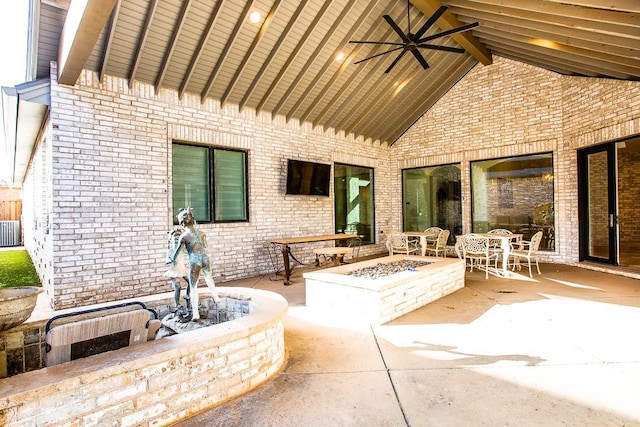 view of patio featuring ceiling fan, an outdoor fire pit, and central air condition unit