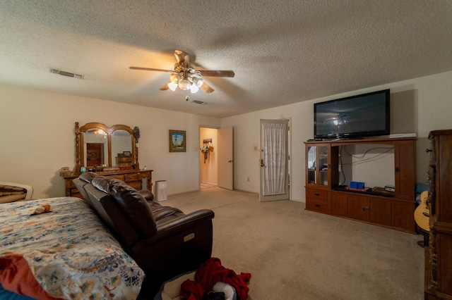 living room featuring ceiling fan, light colored carpet, and a textured ceiling